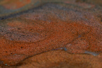 Fluid inks. Multicolor glitter background. Brown sand effect