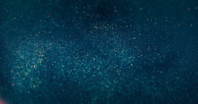 Blur sparkles background. Bokeh light. Water bubbles. Defocused blue orange color glowing shimmering grain texture dark abstract overlay.