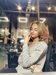 woman talking on the phone in a cafe