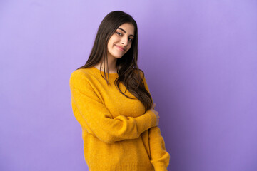 Fototapeta premium Young caucasian woman isolated on purple background laughing