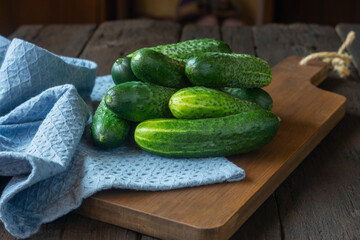 Bunch of fresh cucumbers on a cutting board