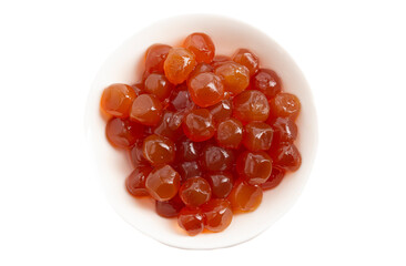 Bowl of Caramel Tapioca Pearl Balls Used in Boba Tea on a White Background