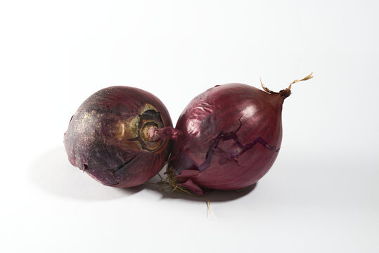 Two red onions on white isolated background 