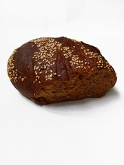 Black bread with sesame seeds on white background