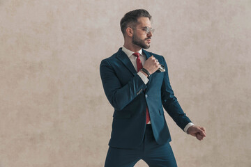 handsome elegant businessman in suit with sunglasses