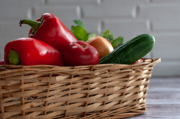 Various vegetables in a wicker basket. Food. Tomatoes