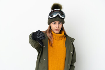 Skier caucasian woman with snowboarding glasses isolated on white background showing thumb down with negative expression