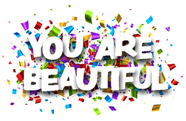 You are beautiful sign on cut ribbon confetti background.