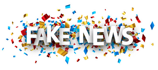 Fake news sign over colorful cut ribbon confetti background.