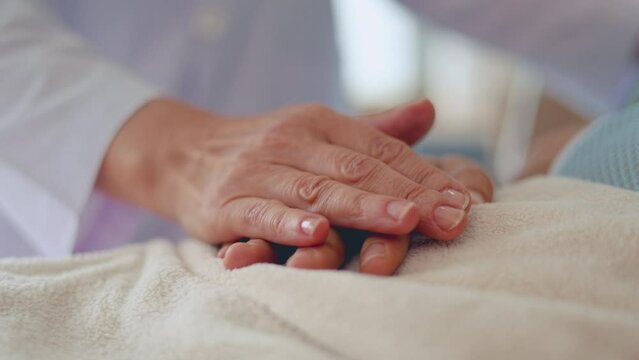 Close up shot of people hands are having encouragement to patien to get well soon.