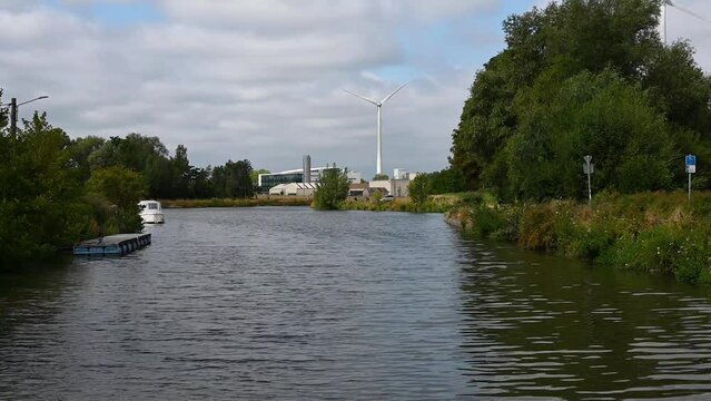 Seneffe, Wallon Region, Belgium, Old industrial plants and chimney at the banks of the sea canal
