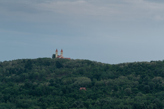 Village church on hill against gloomy sky, Saint Anthony church on Topuz hill near Derventa