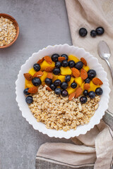 Bowl of oatmeal porridge with fresh fruits