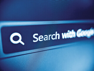 Closeup view of an internet web browser search box displayed on a pixelated screen in blue