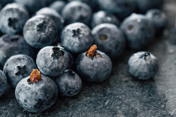 Wet ripe blueberries close up, macro shot.