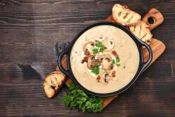 Mushroom soup with bread and fresh mushrooms