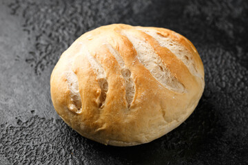 Fresh Homemade cob bread on rustic dark background