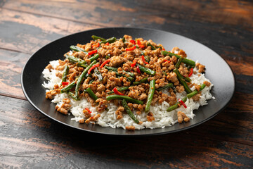 Pork Stir Fry with Green Beans, rice, garlic, chili and ginger. Asian food.
