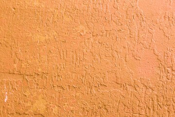 Abstract background of a wooden surface with damaged paint.