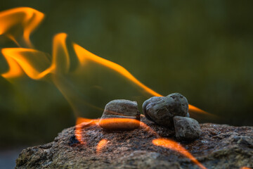 Hot rocks burning with isopropyl alcohol