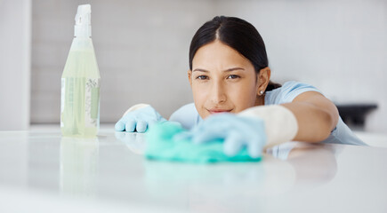 Kitchen, product and cleaner cleaning a table with dirt or dust with detergent, cloth and gloves....