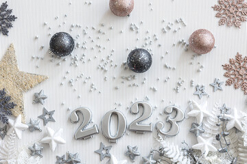 Christmas background with numbers 2023 and decor on a white background.