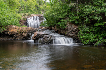 Mink Falls is secluded and hidden in a forest beside the Trans Canada Highway north of Lake Superior, Ontario.