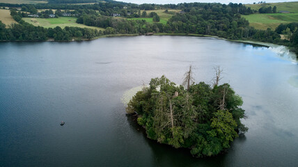 Aerial image of a Scottish lake with a little island in the middle