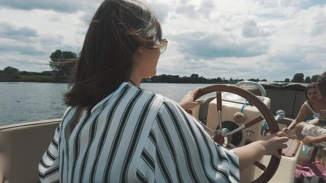 turkish lady sails luxuriouse boat trough the Biesbosch in The Netherlands