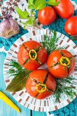 Salted tomatoes with hot pepper and dill. Cold appetizer of tomatoes. Marinated tomatoes