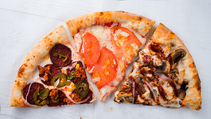 three slices of pizza on a white background