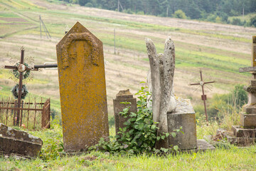 Old cemetery of Polish Jews in Ukraine. Ancient abandoned graves. Cemetery sculpture of the 18th and 19th centuries,Cemetery in Ukraine 2022