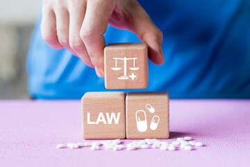 Doctor hand arranging wood block stacking with icon justice healthcare and pharmacology Labor Law Lawyer Legal Concept medical.