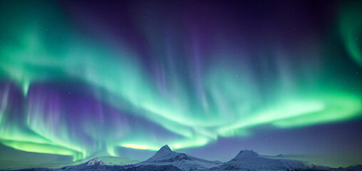 Northern Lights over snowy mountains. Aurora borealis with starry in the night sky. Fantastic...
