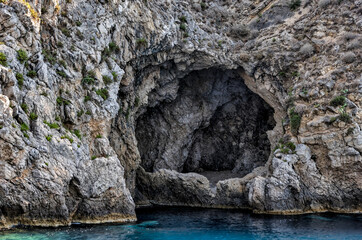 Taormina, Italy - July 22, 2022: The rocky seaside and coastline below Taormina in Sicily
