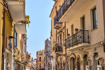 Obraz premium Taormina, Italy - July 22, 2022: Scenic streets and sidewalks in Taormina, Sicily 