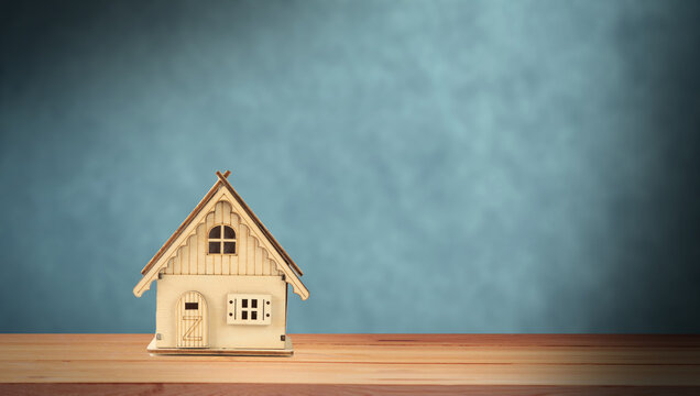 Small wooden house on the table.