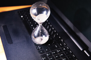 Hourglass on laptop