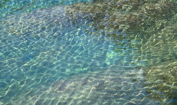 Sea beautiful clear transparent water turquoise blue surface.