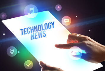 Holding futuristic tablet, new media concept