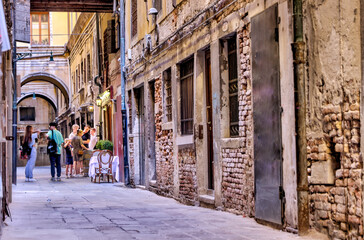 Venice, Italy - July 5, 2022: Building exteriors along the canals in Venice Italy
