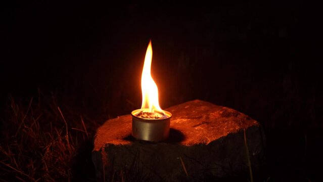 Special handmade warming candle for winter season to warm or to make hot drinks in winter for ukrainian troops during war of Russia against Ukraine 2022, 2023. Candle light of military trench candle