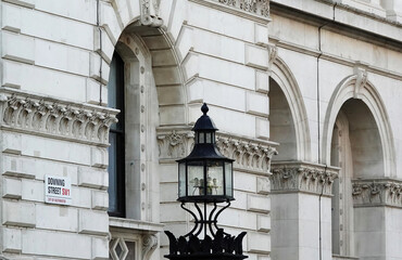 Downing Street sign on the wall of a building in Westminster, London, UK.  © Nigel Harris