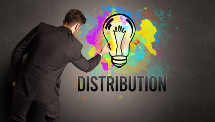 businessman drawing colorful light bulb