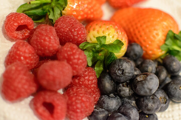 raspberries, strawberries and blueberries