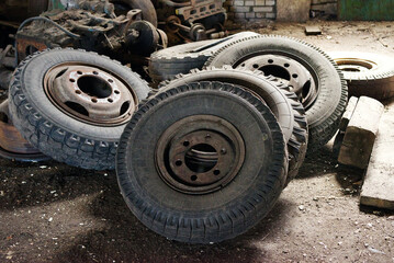 Fototapeta na wymiar Pile of used car old tires close up