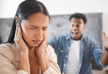 Woman scared, noise and abuse from angry man in the living room at home. Fear, bullying and sad wife cover ears as husband shout, scream or yelling at home with marriage conflict, drama or fight - obrazy, fototapety, plakaty