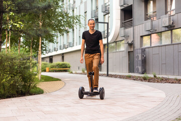 man stand near segway hoverboard