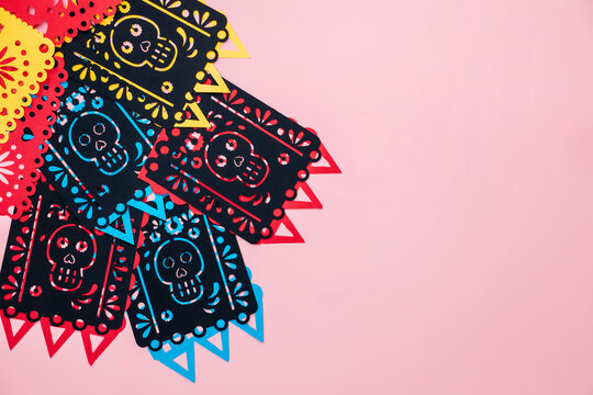 mexico day of the dead paper decorations, background with paper flags, skulls