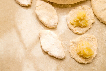 Hand knead dough on cutting board for homemade bakery